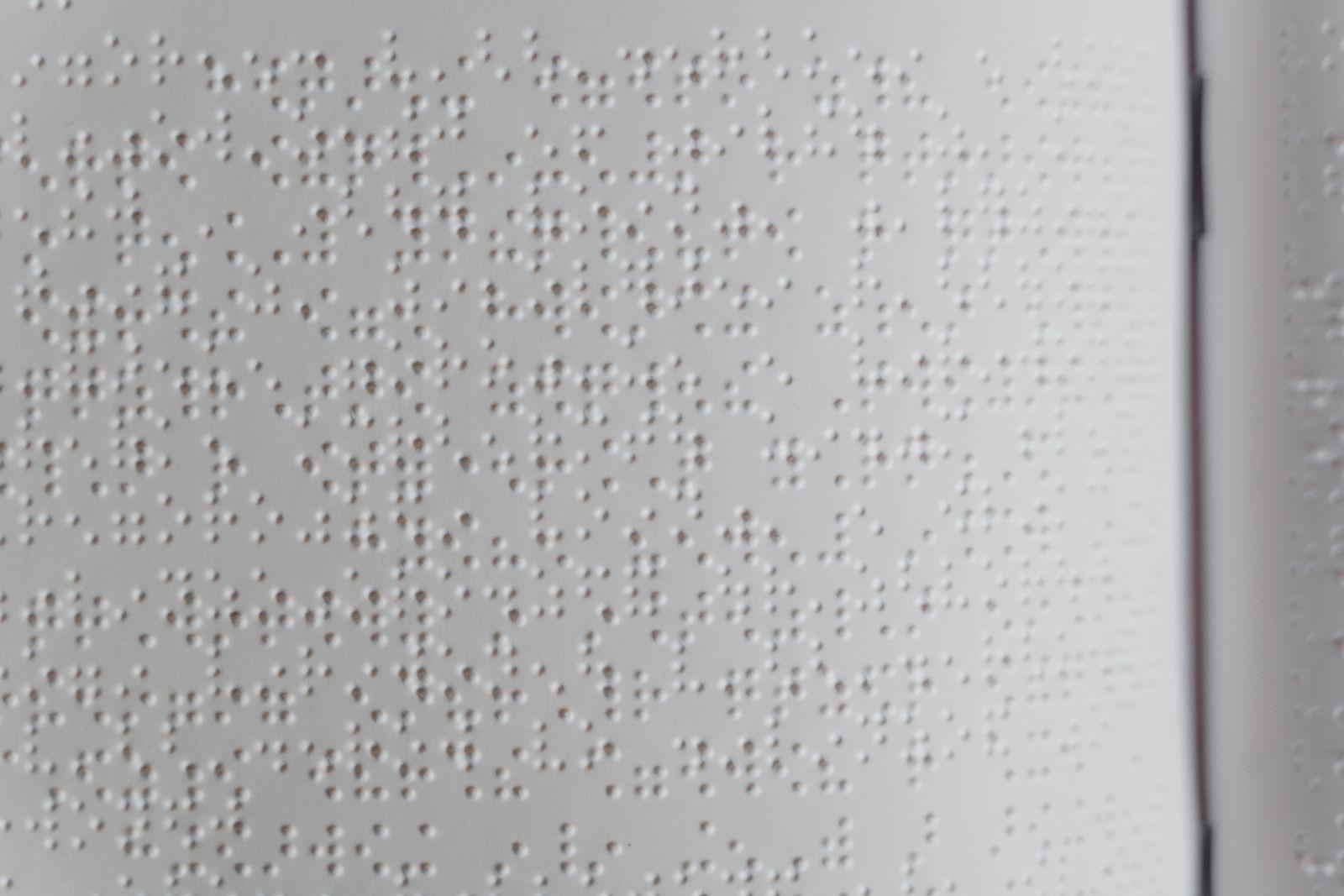 Close-up of braille characters on an accessible document