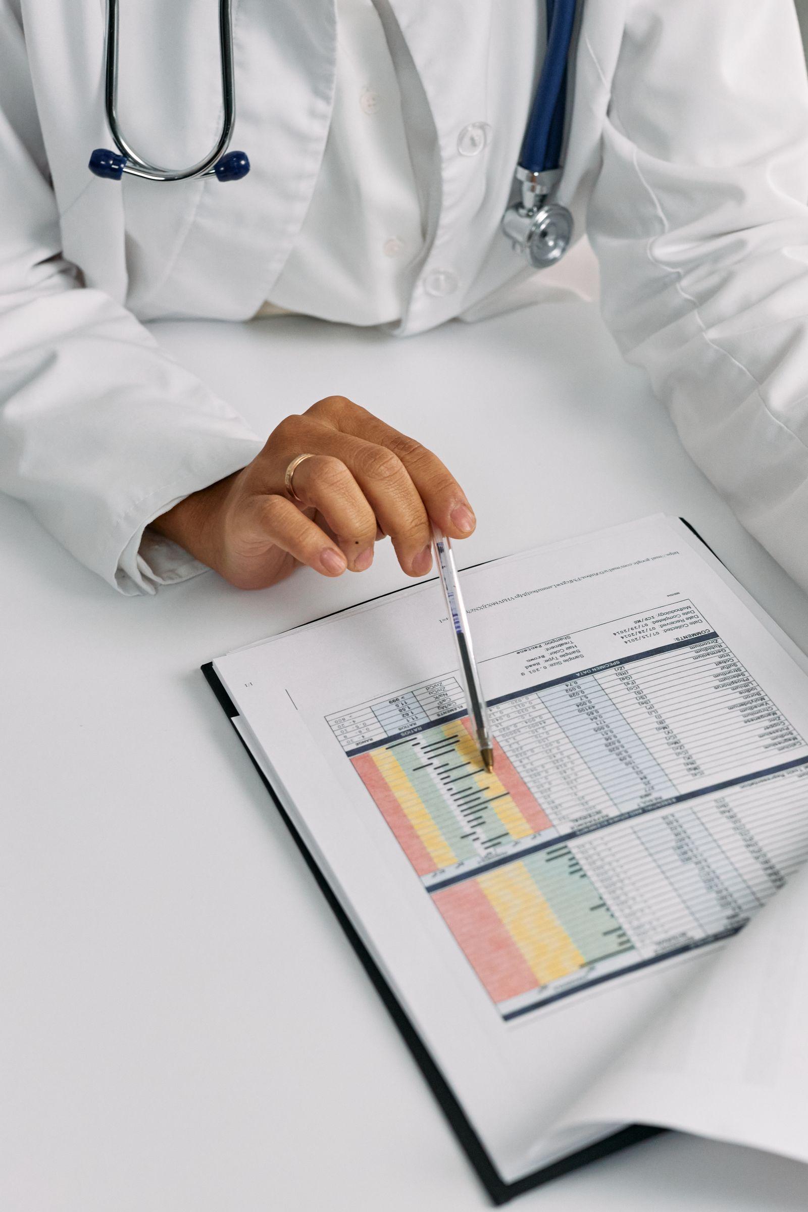 Doctor reviewing translated patient chart data point by point