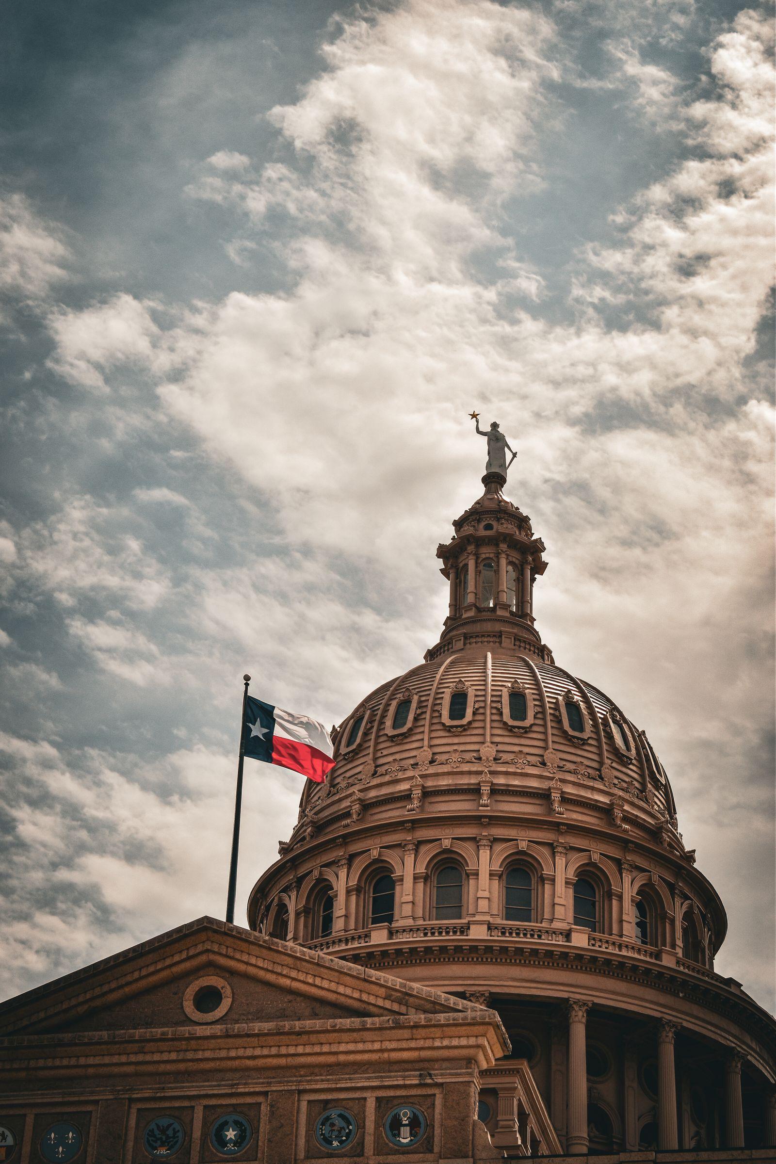 Texas State Capitol dome with the Texas flag — Taika Translations' home state